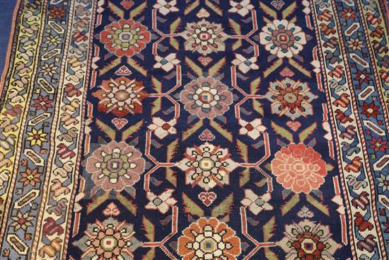A Caucasian blue ground runner, 13ft 2in by 3ft 8in.